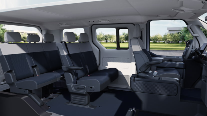 Seitliche Innenansicht des Kia PV5 Passenger mit flexibler Sitzanordnung im Fond, 3 Sitzreihen
